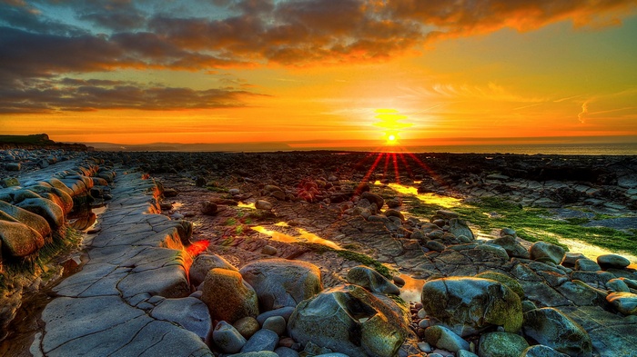 Rocky coastline at sunset with ocean view