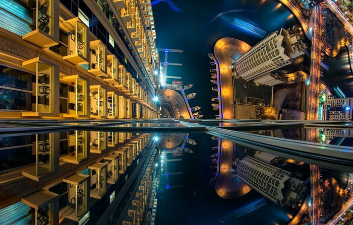 Night cityscape with reflections of buildings and lights