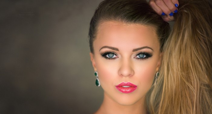 Woman with blonde hair and makeup