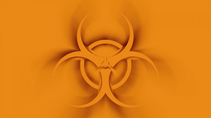 Biohazard symbol on orange background