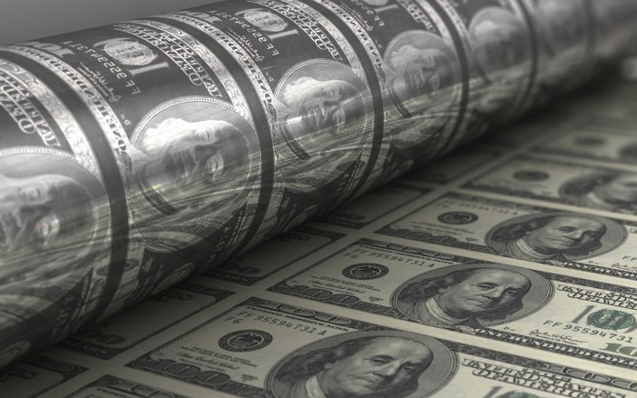 Printing of 100 dollar bills on a cylinder