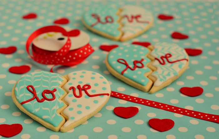 Heart-shaped cookies with "love" written on them