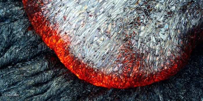 Close-up of flowing lava with red and white textures