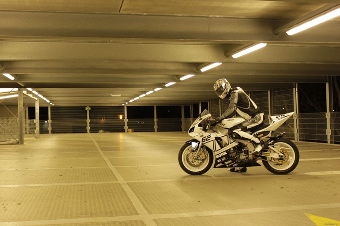 Motorcyclist on a Yamaha motorcycle in a parking garage