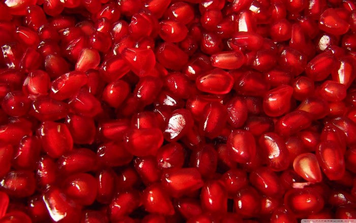 Close-up of fresh red pomegranate seeds
