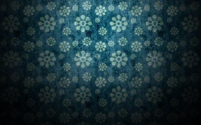 Blue and green textured pattern with floral motifs
