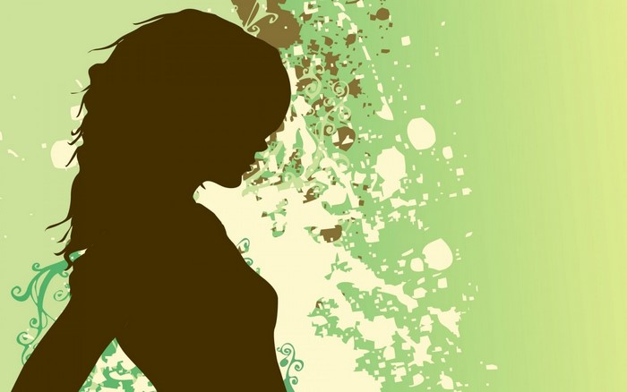 Silhouette of a woman with abstract green background