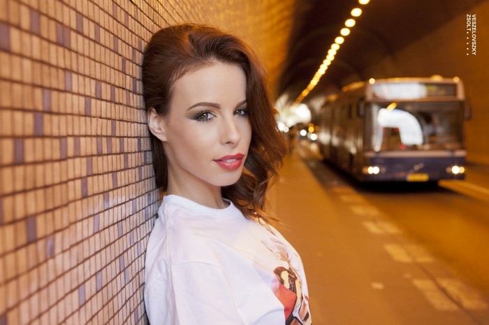 Woman in a tunnel with a bus, photography by Veszelovszky Zsolt