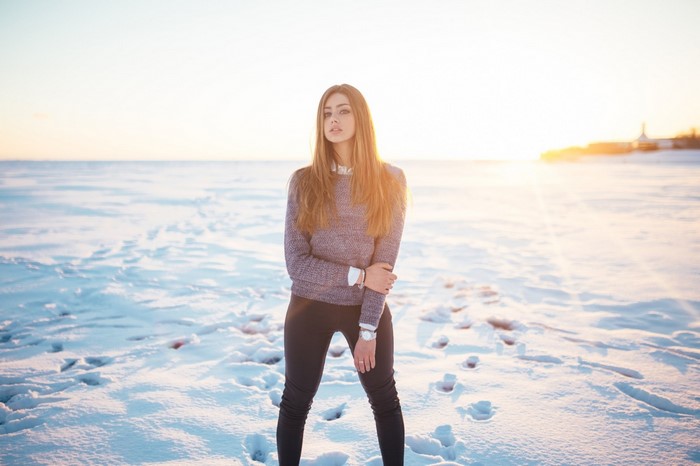 Woman in sweater and leggings in snow