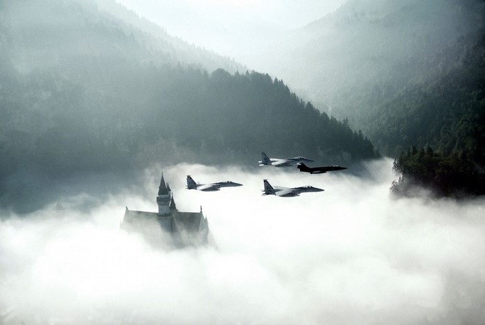 F-15 Eagle jets fly over Neuschwanstein Castle in fog