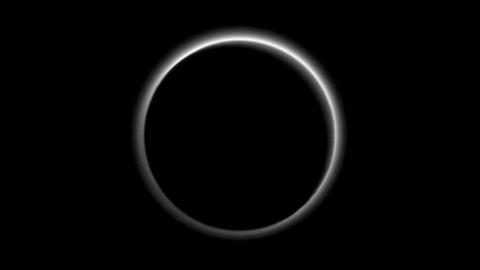 Pluto's backlit atmosphere during an eclipse