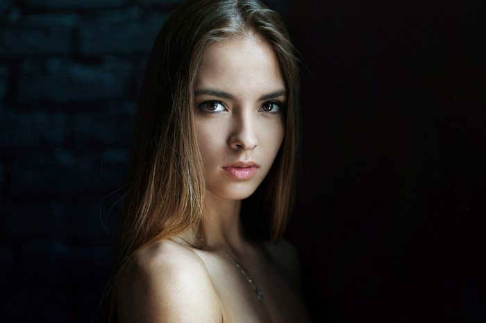 Portrait of a young woman with long brown hair
