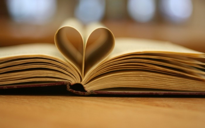 Open book with pages shaped into a heart