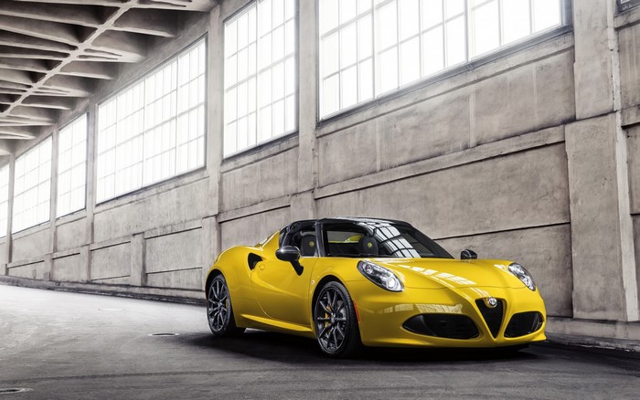 Yellow Alfa Romeo 4C Spider in industrial building