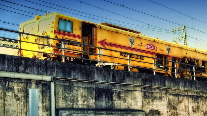 Yellow Zürcher Unimat 4S train on tracks