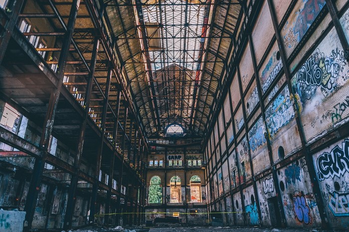 Graffiti-covered abandoned industrial building interior