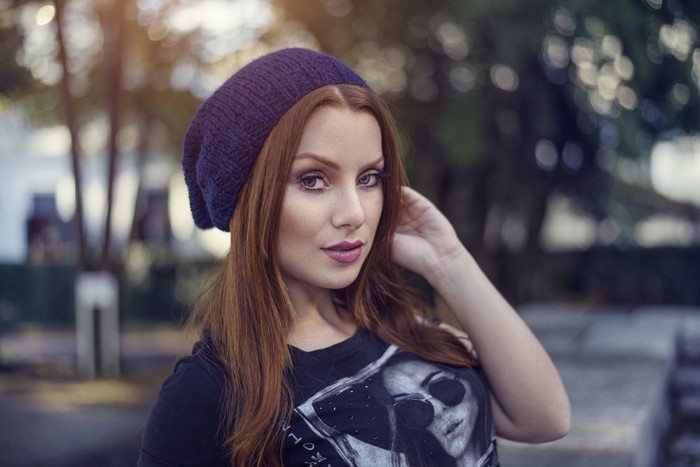 Woman wearing a blue beanie and t-shirt