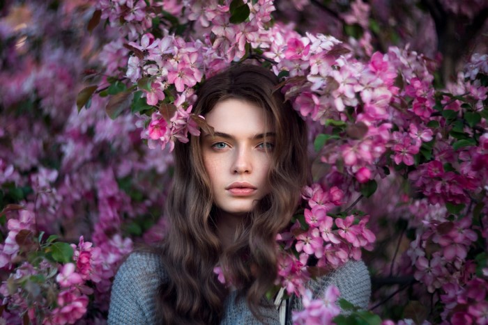 Woman with pink flowers in her hair
