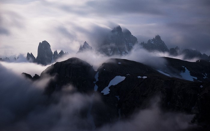 Misty mountain peaks in the Alps