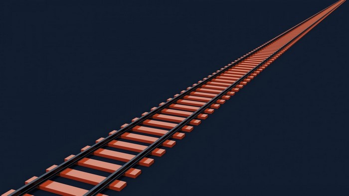 Orange train tracks on a dark blue background
