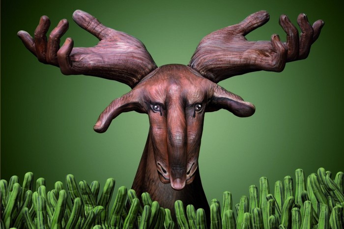 Deer with hands as antlers in a field of plants
