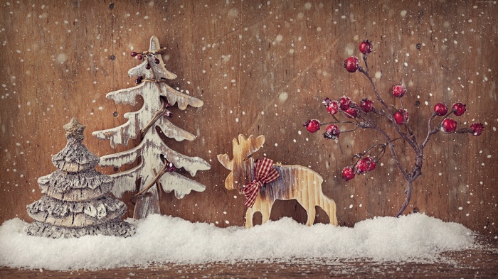 Christmas decorations with snow and wooden reindeer
