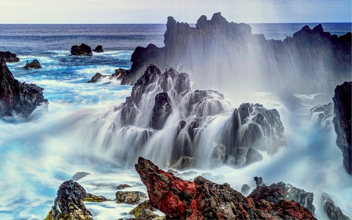 Waves crashing on rocky shore at Easter Island