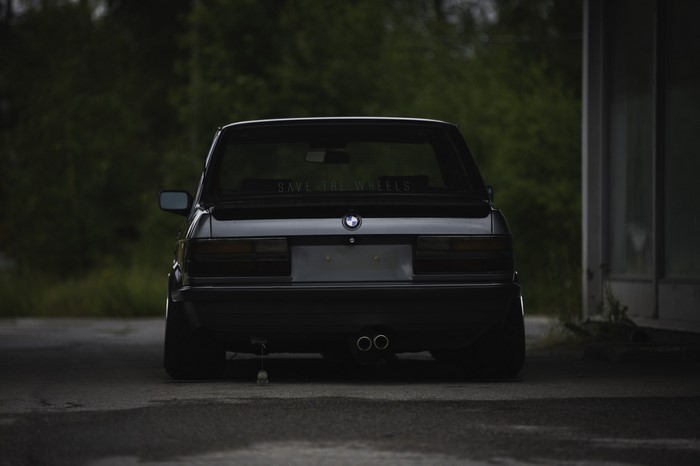 Black BMW E28 with "SAVE THE WHEELS" sticker