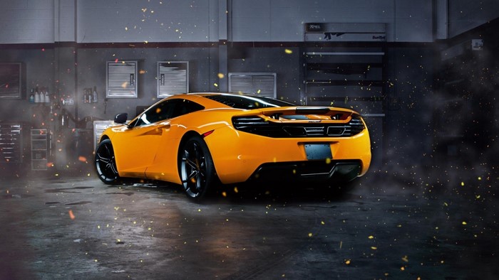 Orange McLaren MP4-12C Sports Car in Garage