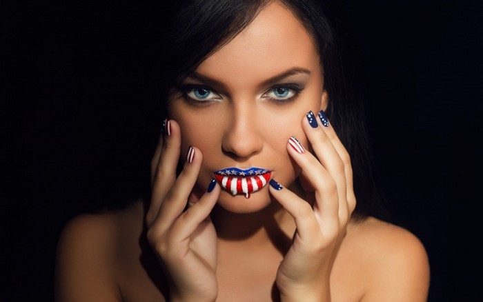 Woman with American flag makeup and nails