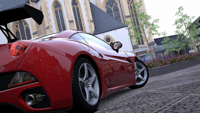 Red Ferrari California sports car with spoiler