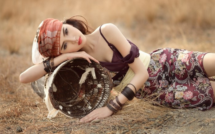 Elegant Woman with Basket in Outdoor Setting