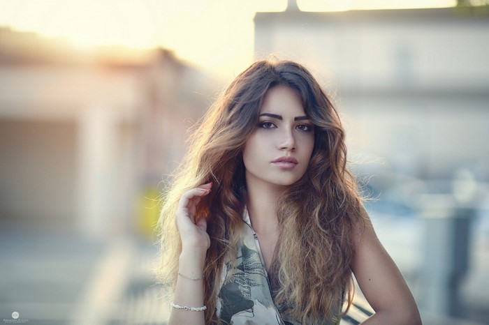 Portrait of a young woman with long brown hair