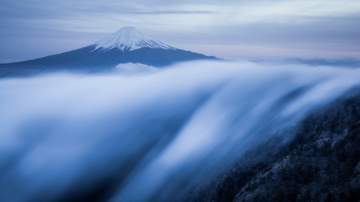 Mount Fuji above clouds at dawn