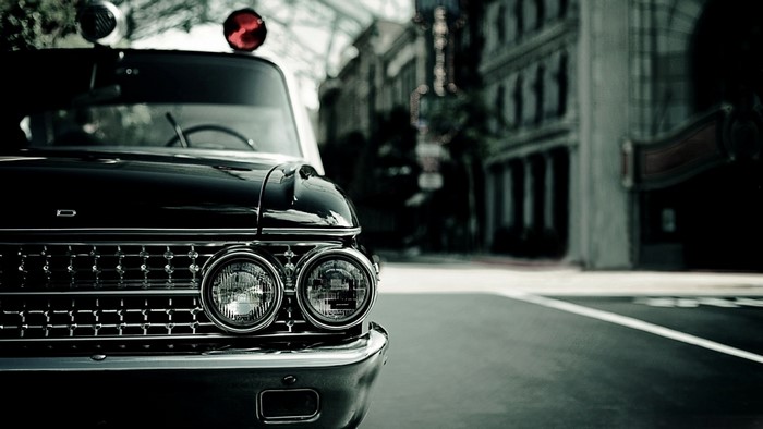 Vintage Ford Police Car on City Street