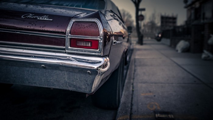 Rear view of a maroon 1970 Chevrolet Chevelle SS parked on a street
