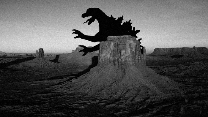 Godzilla silhouette on a rock formation in Monument Valley