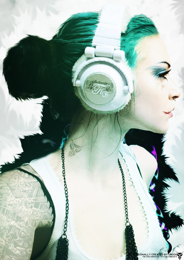 Woman with green hair wearing Skullcandy headphones