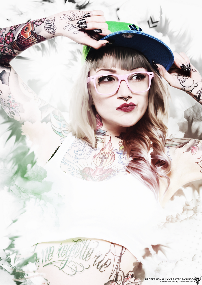 Woman with tattoos wearing glasses and a baseball cap