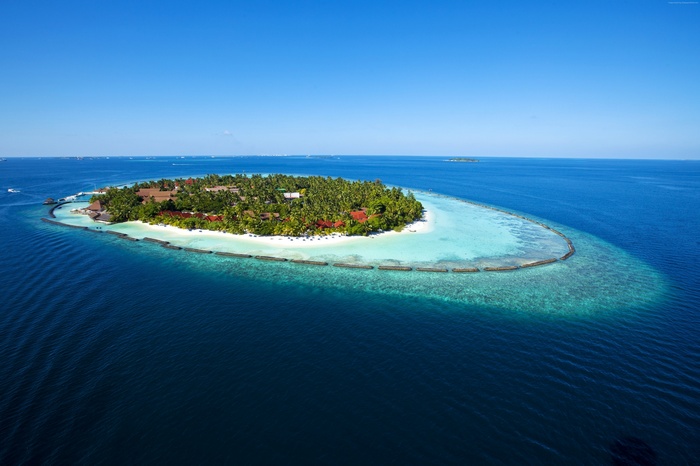 Aerial view of a tropical island resort in the Maldives