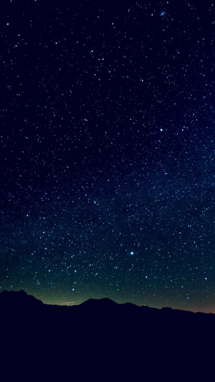 Night sky full of stars over mountains