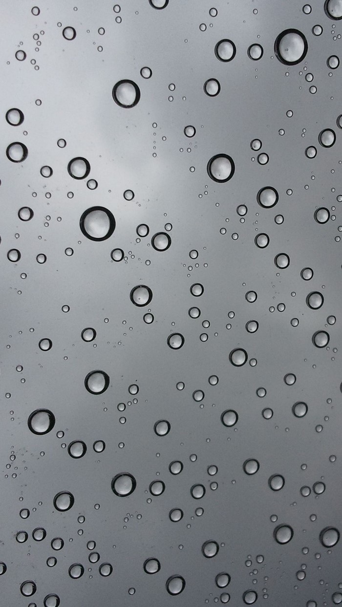 Monochrome water drops on glass