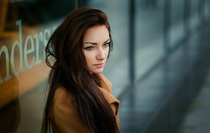 Woman with long brown hair and blue eyes