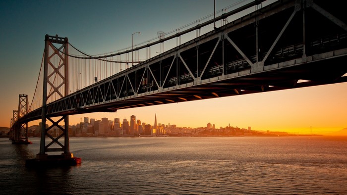 Bay Bridge at sunset with San Francisco skyline