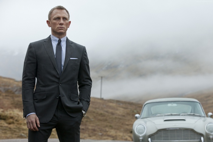 Daniel Craig as James Bond 007 with Aston Martin