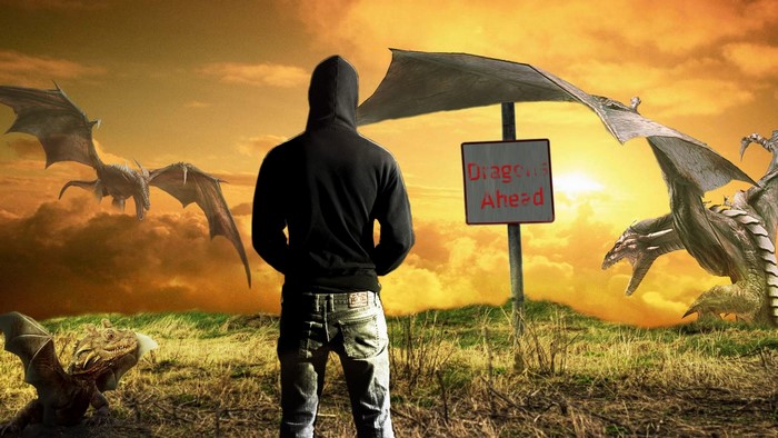 Person facing dragons with 'Dragons Ahead' sign