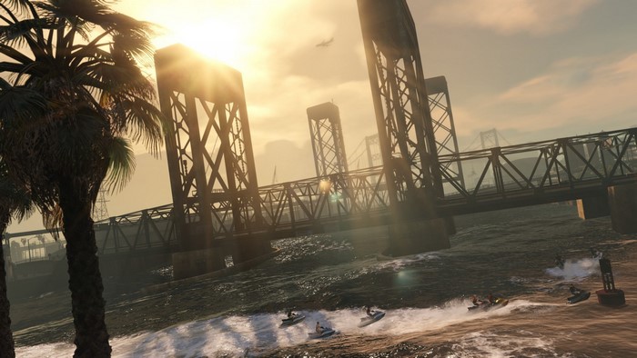 Jet skis under a bridge at sunset in Grand Theft Auto V