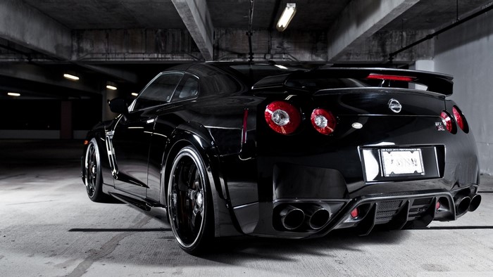 Black Nissan GT-R parked in a garage