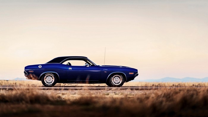 Blue 1970 Dodge Challenger on a dirt road