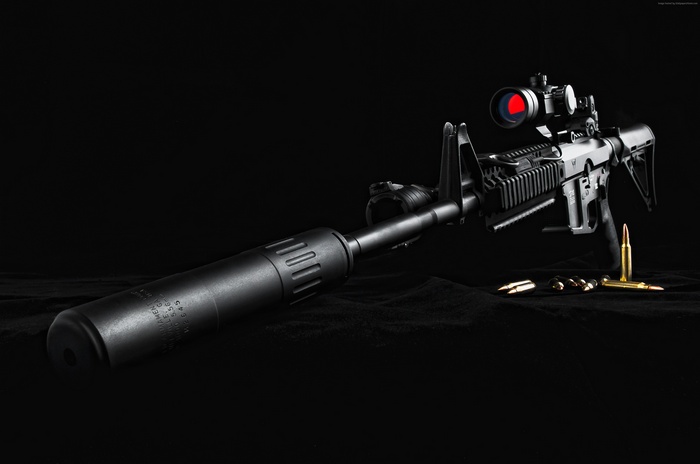 AR-15 assault rifle with suppressor and scope